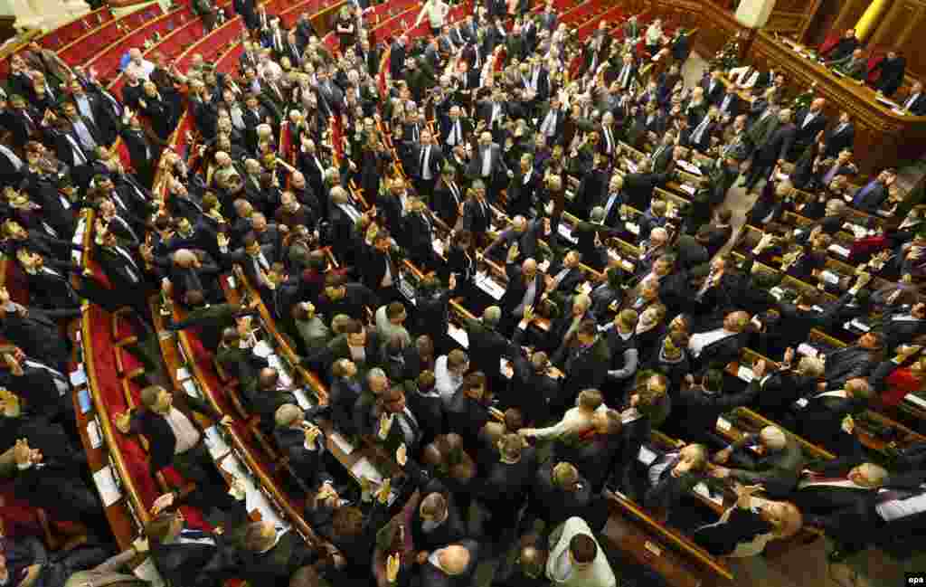 The Ukrainian parliament votes for antiprotest laws, which themselves sparked a fresh wave of protests on January 16, 2014. 