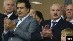 Then-Georgian President Mikheil Saakashvili (left) and Belarusian counterpart Alyaksandr Lukashenka attend the UEFA EURO 2012 final in Kyiv in July 2012.