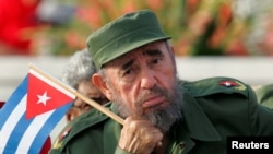 Cuban President Fidel Castro listens to a speaker during the May Day parade in Havana's Revolution Square in 2005. 