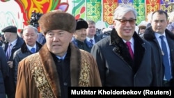 Former Kazakh President Nursultan Nazarbaev and President Qasym-Zhomart Toqaev in 2019