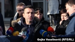 Davor Dragicevic talks to reporters on December 26. 