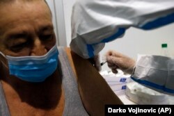 A medical worker administers a shot of COVID-19 vaccine to a man in Belgrade on February 17.