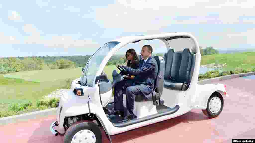Azerbaijan's incumbent president, Ilham Aliyev, has expressed confidence that he will win a third term in the upcoming election on October 9, and has limited his public appearances accordingly. Here, he and his wife, Mehriban Alilyeva, attend the opening of the Azerbaijan National Golf Club in the country's Guba district on September 19.