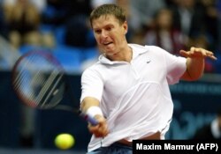 Former Russian tennis great Yevgeny Kafelnikov -- seen here in Moscow in September 2003 -- backed opposition figure and Kremlin foe Aleksei Navalny in the 2018 presidential election. Navalny was barred from running.
