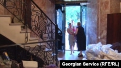 Nunu Chovelidze, her children, and her grandchildren have lived in this former casino in Tbilisi for the last nine years.