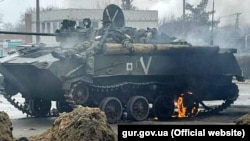 The bodies of dead Russian soldiers are seen atop a Russian APC in the Kyiv region early in the fighting.