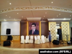 Gurbanguly Berdymukhammedov’s portrait adorns the wall of a Turkmen wedding hall.