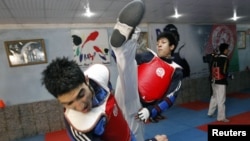 Nekpa (right) has complained about poor training conditions for taekwondo competitors in Afghanistan.