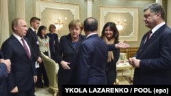 Зустріч у Мінську. Президент України Петро Порошенко, президент Франції Франсуа Олланд, канцлер Німеччини Анґела Меркель і президент Росії Володимир Путін. 11 лютого 2015 року