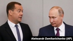 Vladimir Putin (right) and Prime Minister Dmitry Medvedev at Russia's State Duma on May 8.