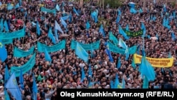 Crimean Tatars mourn those killed in the deportation at a rally on May 18 in Simferopol.