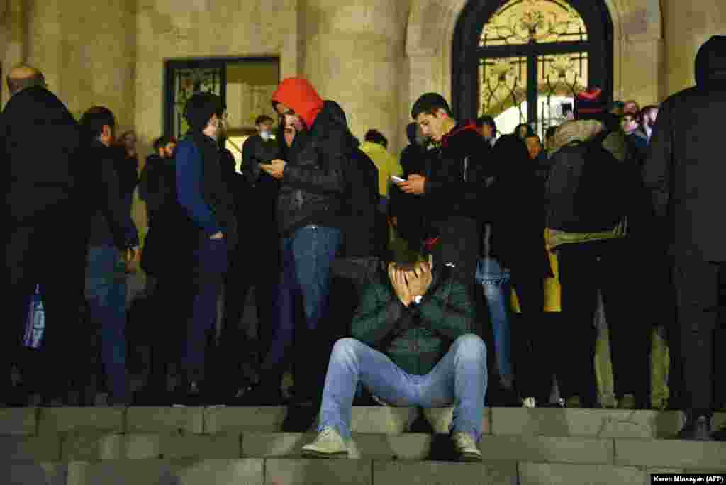 Crowds outside the parliament building in Yerevan. Protesters described feeling "betrayed" by the decision to end the fighting. More than 1,200 Armenian soldiers died in the latest war for Nagorno-Karabakh.