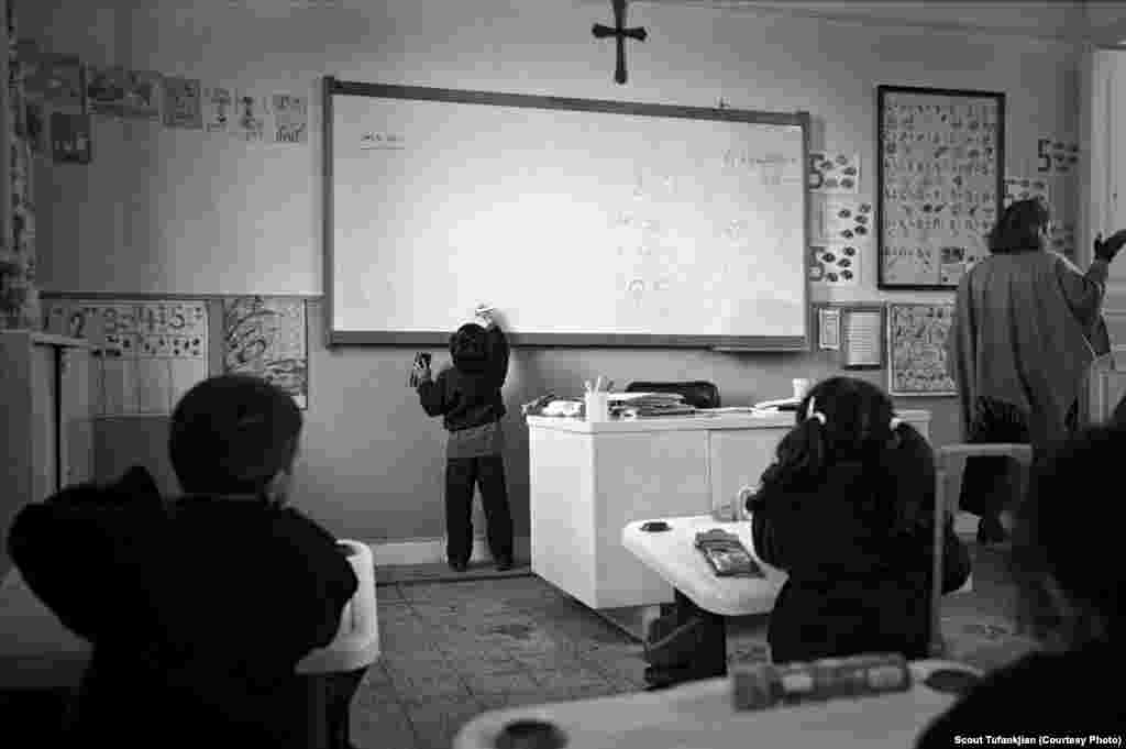 A young student practices the Armenian alphabet at the Boghossian School in Alexandria, Egypt. &quot;I don&#39;t think Armenians have ever fully adjusted to living in the diaspora,&quot; one subject told Tufankjian. &quot;In many ways -- financial stability, home, careers -- they have. But there&#39;s always a longing for something more...something that always pulls them to not fully be engulfed in the cities and countries they are living in now. They are always searching for something that is lost.&quot; &nbsp; &nbsp; 