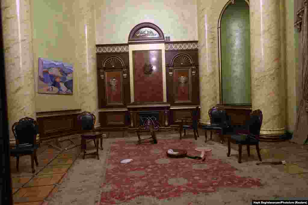 Damage left over inside offices in government headquarters in Yerevan after protesters had rioted. At around 8 a.m. on November 10, Pashinan wrote on Facebook: "Of course, I am in Armenia and I continue to do my job" as Armenian prime minister.
