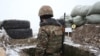 An Armenian soldier on combat duty on the border with Azerbaijan (file photo)