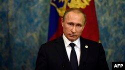 Russian President Vladimir Putin holds a press conference on November 30 in Paris on the sidelines of the climate change summit.