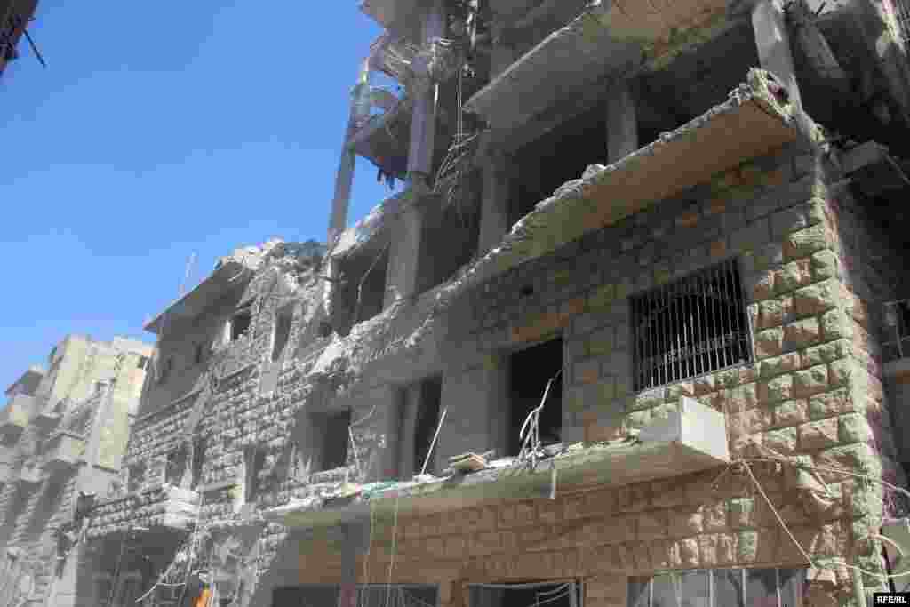 A shattered building in Aleppo's Bustan al-Qasr district on October 11. The British-based Syrian Observatory for Human Rights said around 250,000 people remained trapped in the besieged city.