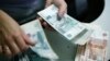 News Analysis: New Russia Sanctions Seen As Burning Slowly