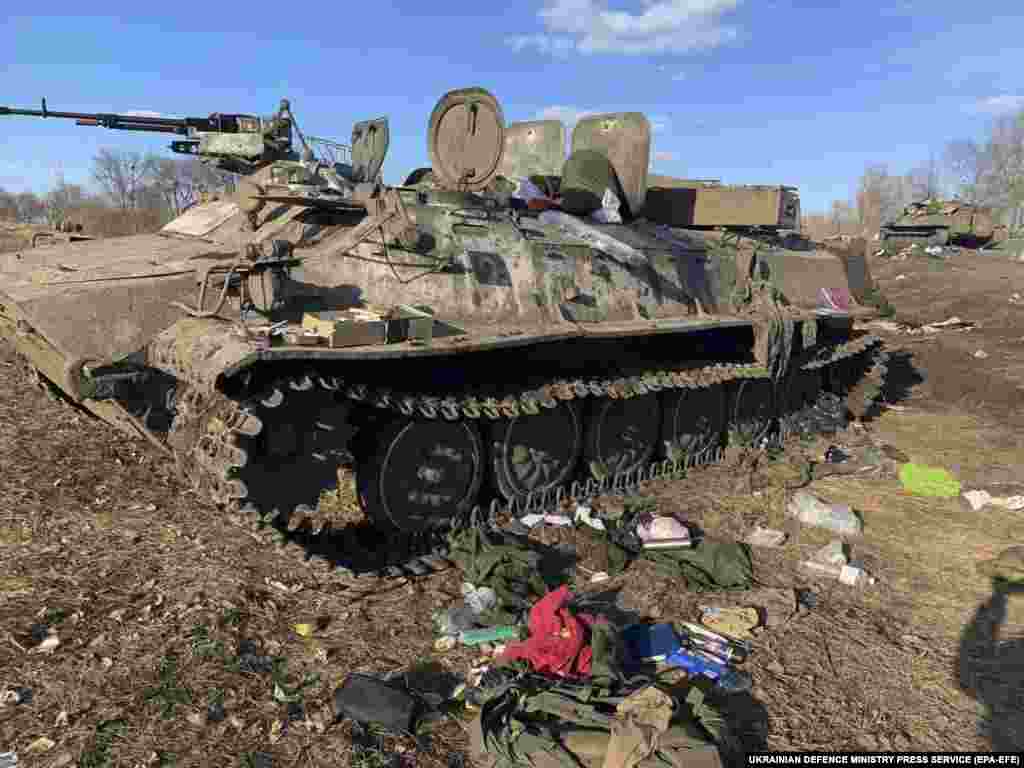 A handout photo from the Ukrainian Defense Ministry shows a damaged Russian armored personnel carrier near Kharkiv on February 24. 
