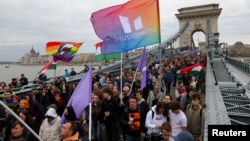 Protesters demonstrate on the Chain Bridge in Budapest after the Hungarian parliament voted on constitutional amendments targeting the LGBT community on April 14.