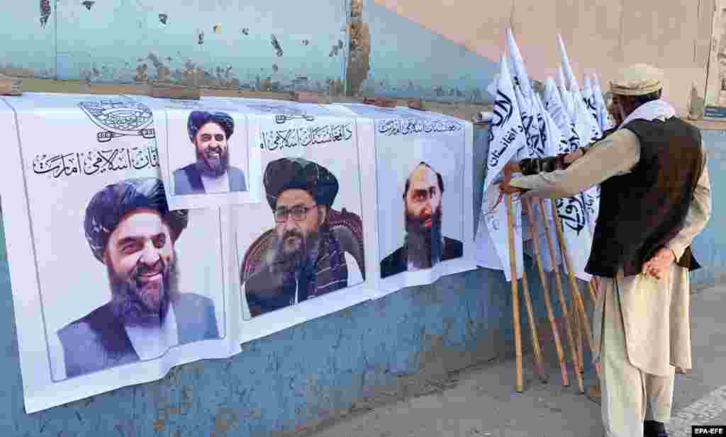 A man sells Taliban flags and posters of the militant group's leaders in Kabul on August 27. 