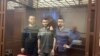 Abubakar Rizvanov (left to right), Kemal Tambiyev, and Abdulmumin Gadzhiyev appear in the courtroom
in August 2021.
