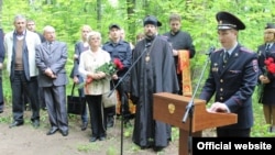 Local dignitaries and the granddaughter of NKVD officer Valter Vand attend the unveiling of a monument to victims of Stalin's Great Terror in Saransk. 