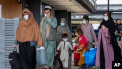 Families evacuated from Kabul arrive in the United States on September 1, 2021.