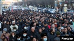 Armenian opposition groups take part in a protest march in Yerevan on February 22.