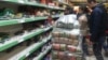 When news of the Central Bank's decision reached the streets, people across Azerbaijan rushed to shops to scoop up whatever they could before prices adjusted to the new reality.