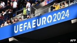 Supporters arrive prior to the UEFA Euro 2024 Group C soccer match between Serbia and England at the arena in Gelsenkirchen on June 16.