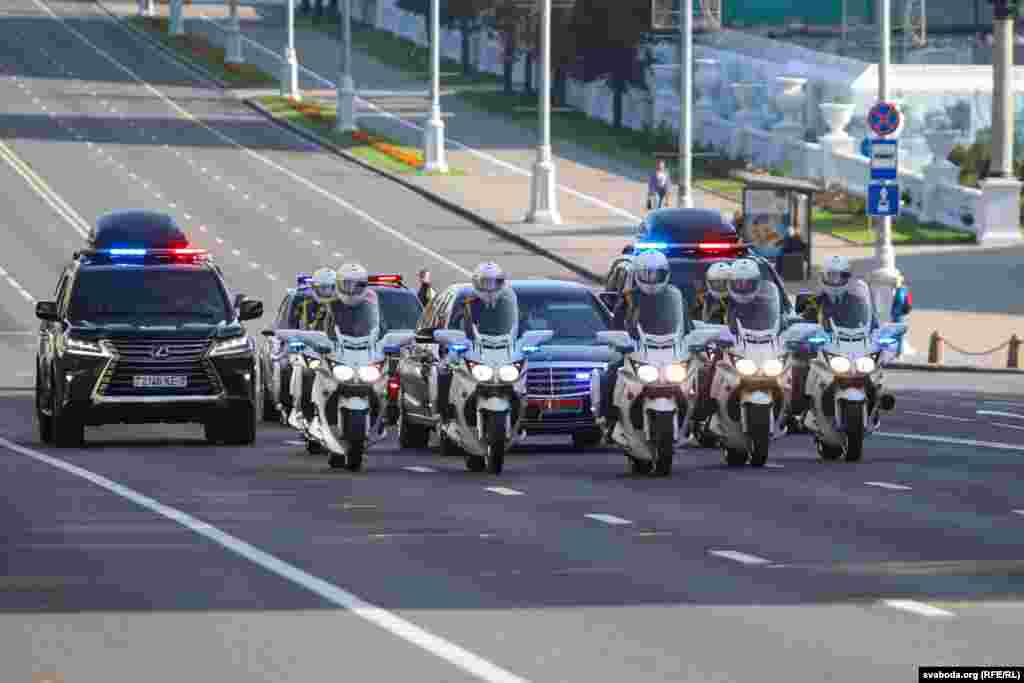 Lukashenka's motorcade moves along the empty Independence Avenue in Minsk, which was closed to traffic in the morning.