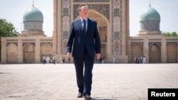 British Foreign Secretary David Cameron visits the Hazrati Imam Mosque in the Uzbek capital, Tashkent, on April 23.