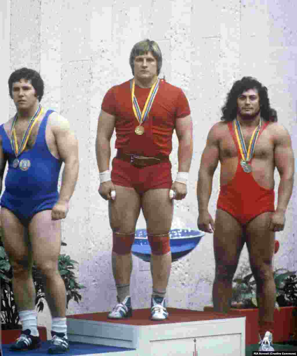 Weightlifters (left to right) Valentin Khristov from Bulgaria, Leonid Taranenko of the Soviet Union, and Hungary's Gyorgy Szalai on the medal podium. 