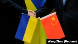 Ukrainian officials and lawmakers told RFE/RL that Kyiv gave in to Chinese pressure to remove its name from an international statement about human rights abuses in Xinjiang.