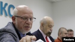 Members of the Russian Presidential Human Rights Council, Mikhail Fedotov (left), Valery Borshchyov (second left) Kirill Kabanov (third left), at a news conference concerning the investigation into Sergei Magnitsky's death.