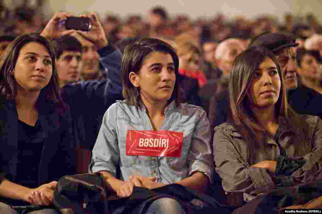 Hasanli's rallies have drawn a wide mix of supporters, from older Azerbaijanis to the very young. Here, a young supporter in Sumgayit wears a sticker bearing Hasanli's campaign slogan -- Basdir!, or "Enough!"