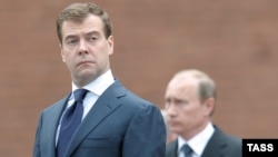 Is Medvedev (left) doing the dirty work ahead of Putin's return to as president?