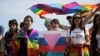 People take part in a gay pride rally in St. Petersburg in 2017. Activists say that the new law, which puts LGBT activism on par with inciting violence or distributing pornography, is being used to distract Russians from the war in Ukraine.