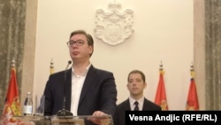 Serbian President Aleksandar Vucic (left) speaks to reporters in Belgarde as Marko Djuric, director of the Serbian government's Kosovo office, looks on in February 2019.
