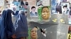 Two Afghan women in Kabul walk past posters of presidential and provincial candidates ahead of elections in 2009.