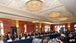 G20 finance ministers gather for the first group session in Horsham, England.