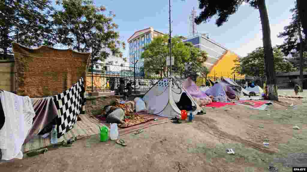 Internally displaced Afghan families in tents at a park in Kabul on August 18. The Taliban has demanded civilians hand over all government property, including weapons. 