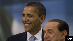 U.S. President Barack Obama and Italian Prime Minister Silvio Berlusconi at the start of the G8 summit 
