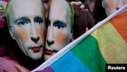 Protesters wearing masks of Russian President Vladimir Putin wearing makeup pretend to kiss as they take part in a demonstration against what they see as Rusian laws that discriminate against the LGBT community outside the Russian Embassy in London in 2014.